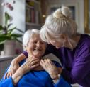 Representation of woman with Alzheimer's disease being cared for